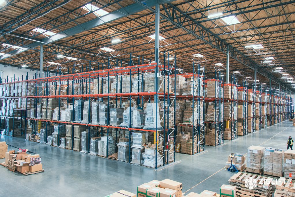 Rows of industrial pallet racks loaded with pallets in a Pittsburgh warehouse